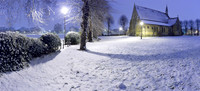 A stitched panorama of All Saints' church, Putney Common, in the snow, taken before dawn